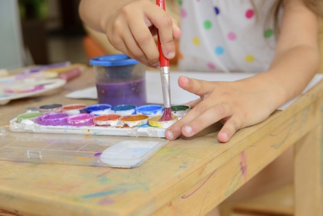 Child painting with watercolours